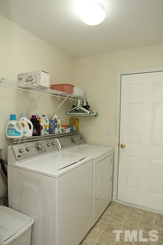 133 Mickleson Ridge Drive Raleigh, NC 27603 - Photo 7 of 18 a utility room with dryer and washer