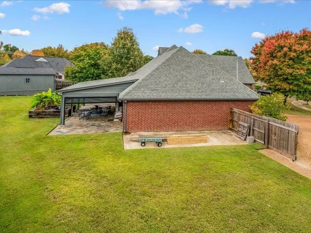 a front view of a house with a big yard
