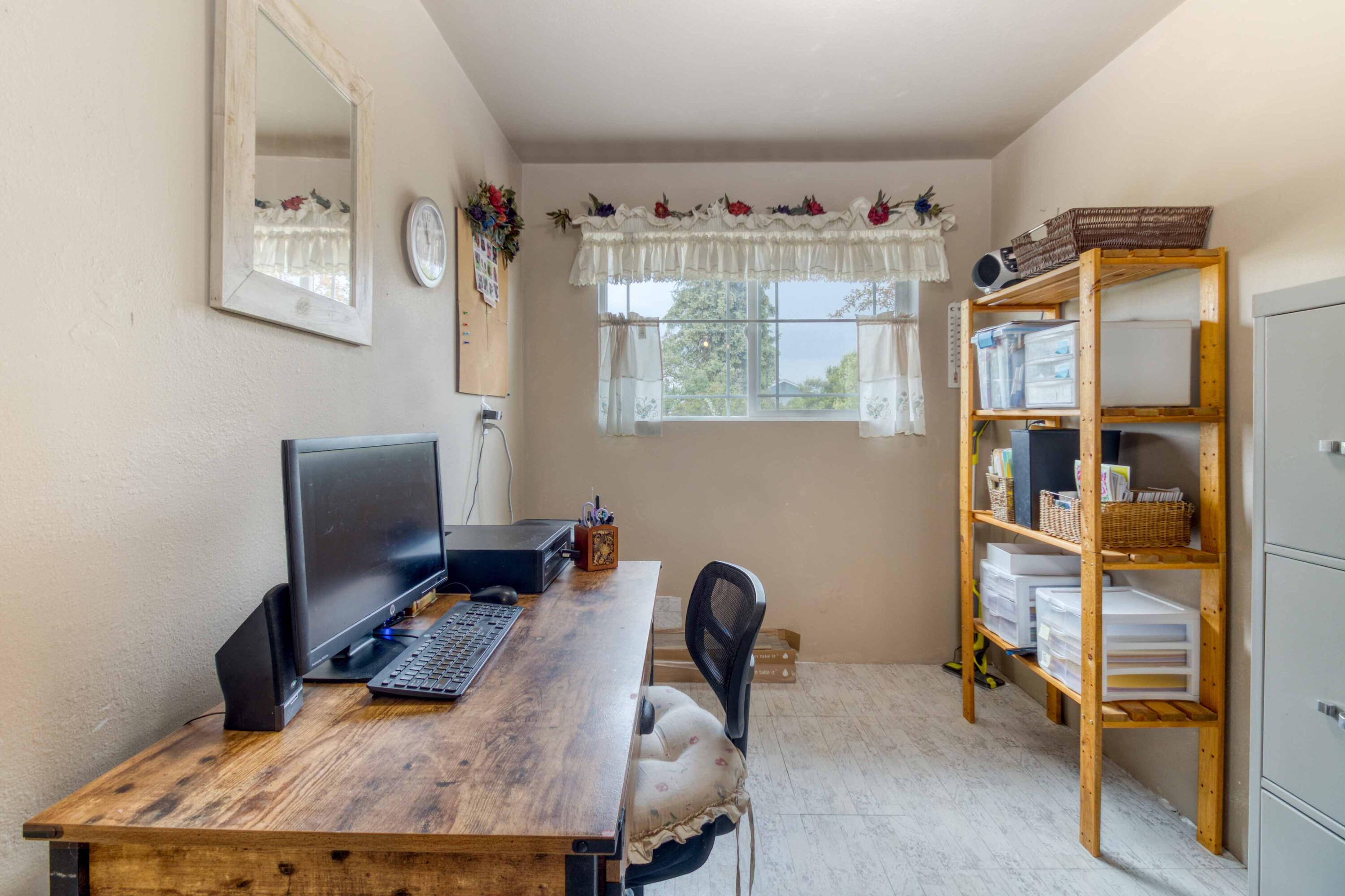 566 Northwest Mc Donald Road Prineville, OR 97754 - Photo 20 of 41 a bedroom with a bed and a desk