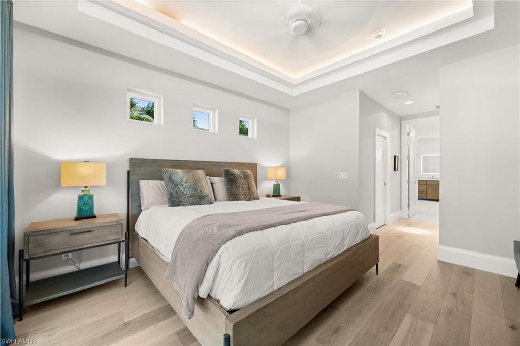 1963 Bethany Place Naples, FL 34109 - Photo 17 of 50 Soft tones, tray ceilings with recessed lighting, and natural light create a peaceful retreat.