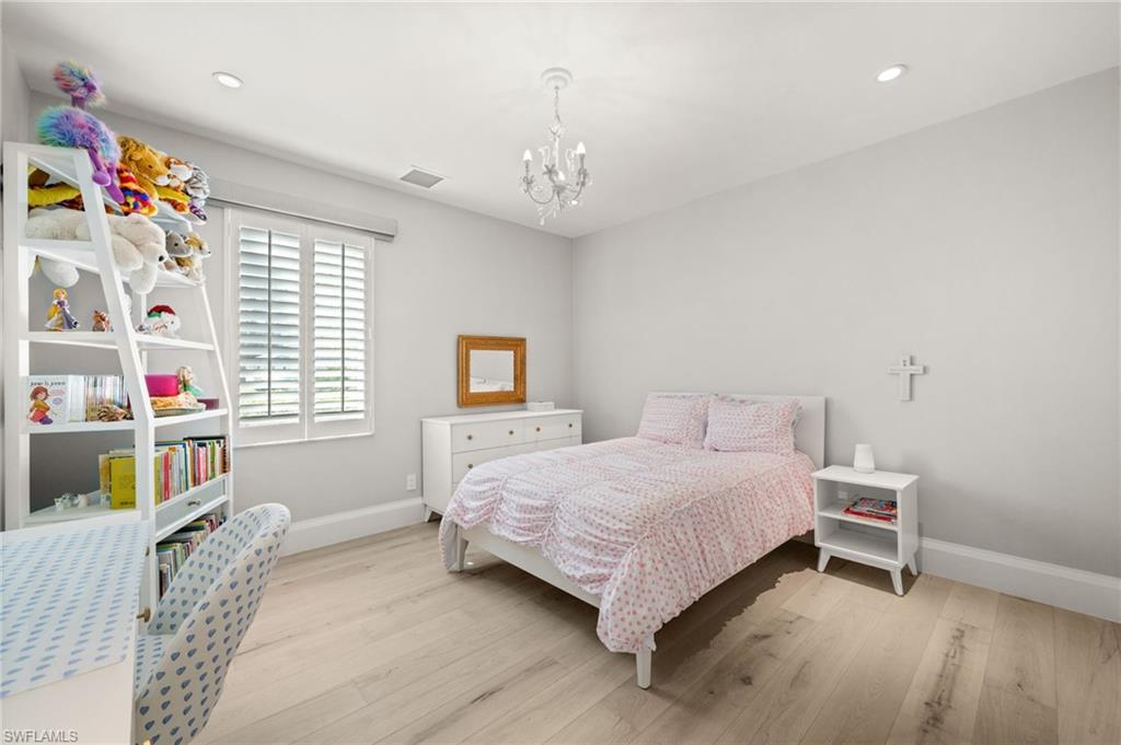 1963 Bethany Place Naples, FL 34109 - Photo 19 of 50 A peaceful secondary bedroom with room to relax, study, or play.