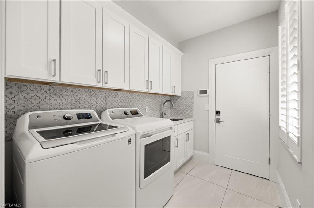 1963 Bethany Place Naples, FL 34109 - Photo 24 of 47 a utility room with dryer and washer