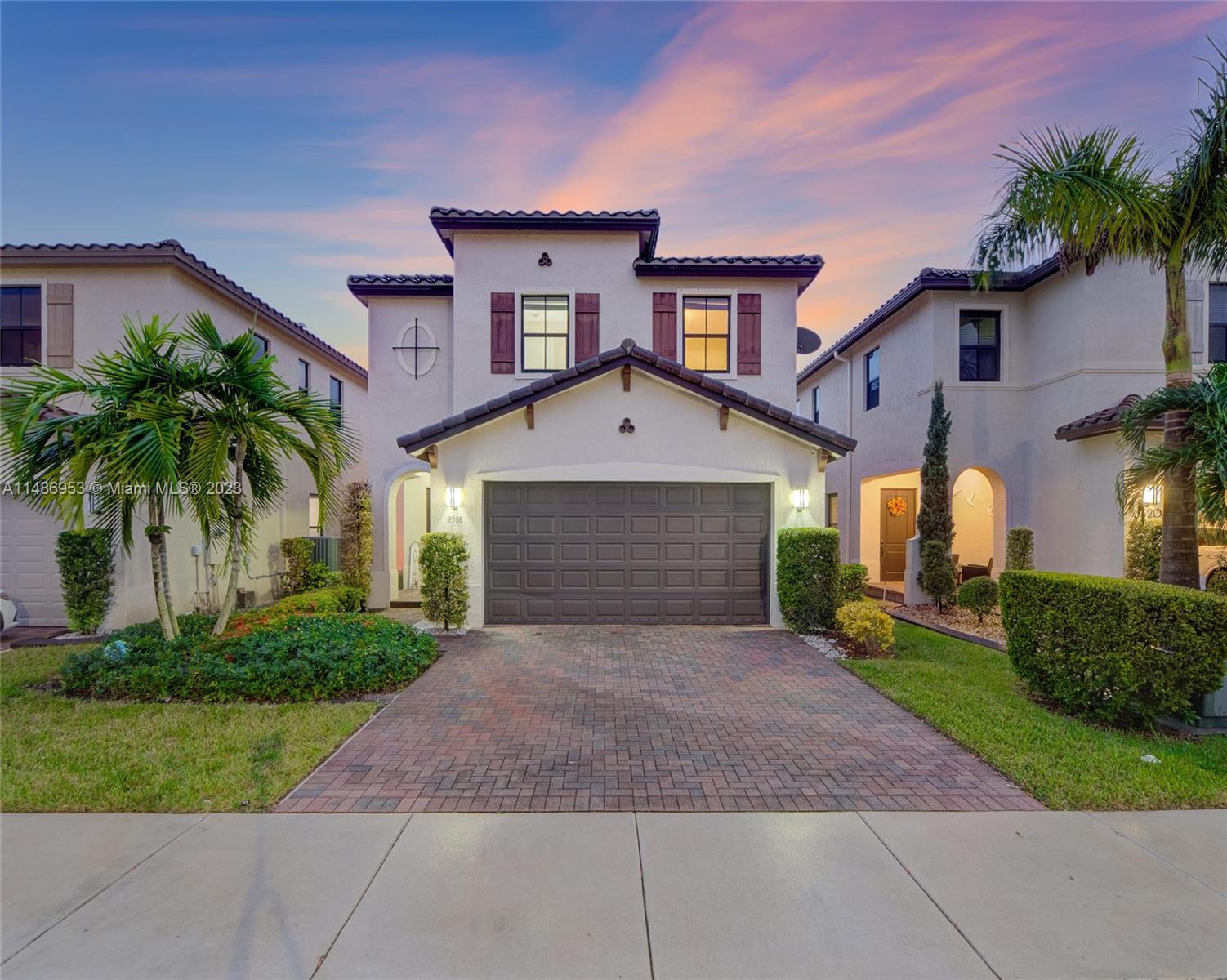 3308 West 95th Terrace Hialeah, FL 33018 - Photo 1 of 43 a front view of a house with a yard and garage