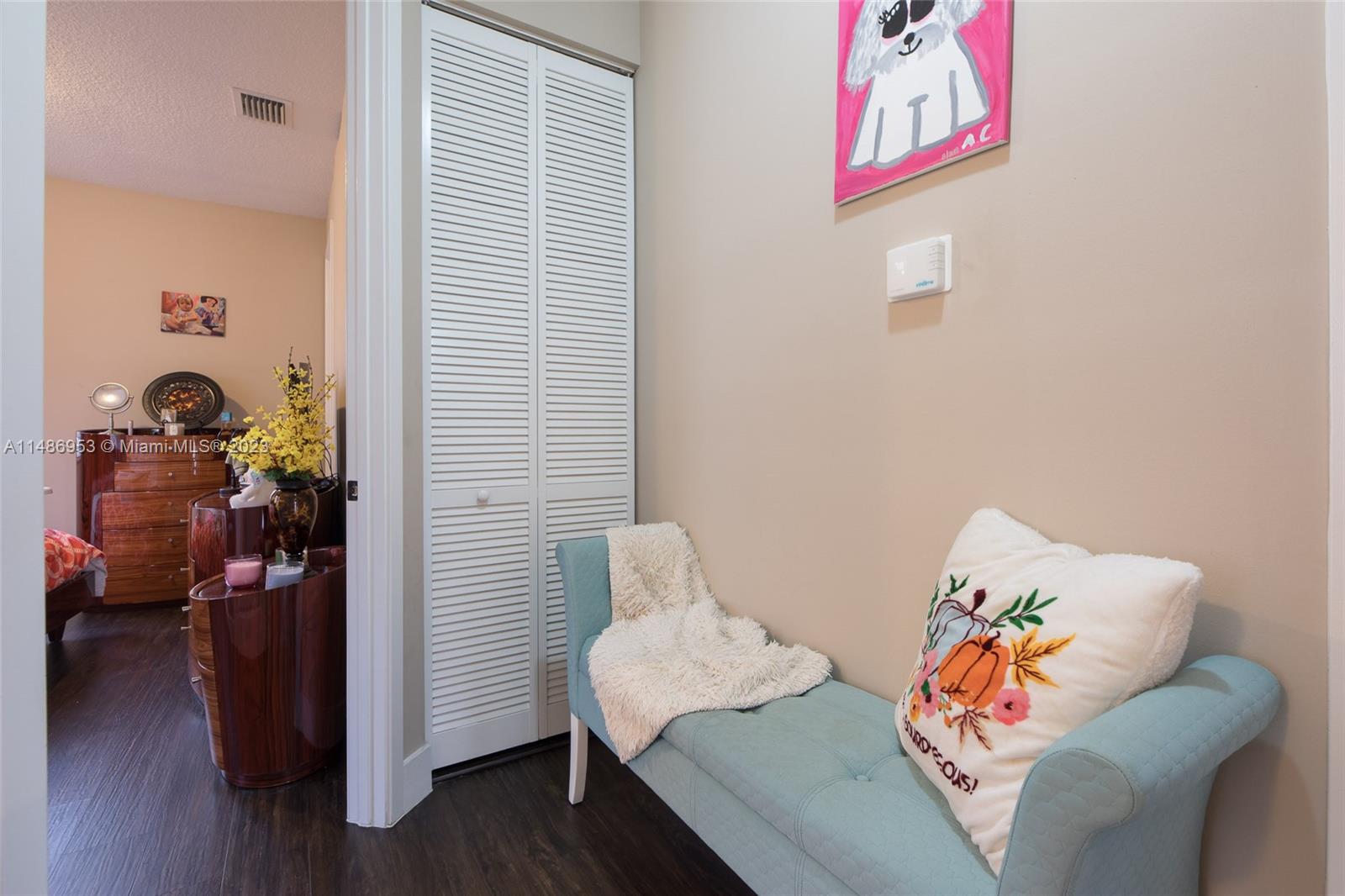 3308 West 95th Terrace Hialeah, FL 33018 - Photo 16 of 43 a living room with furniture and wooden floor