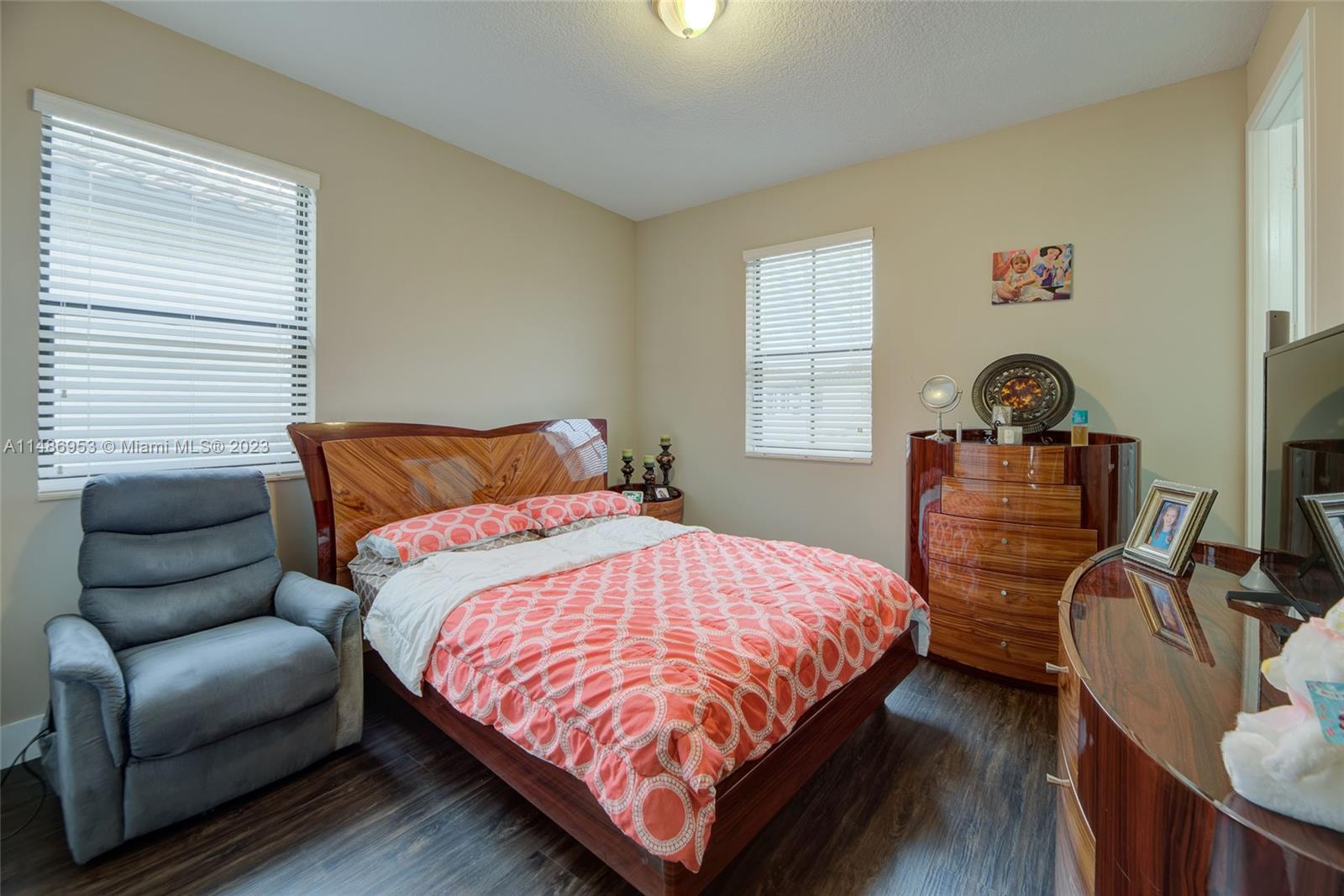 3308 West 95th Terrace Hialeah, FL 33018 - Photo 17 of 43 a bedroom with bed and window