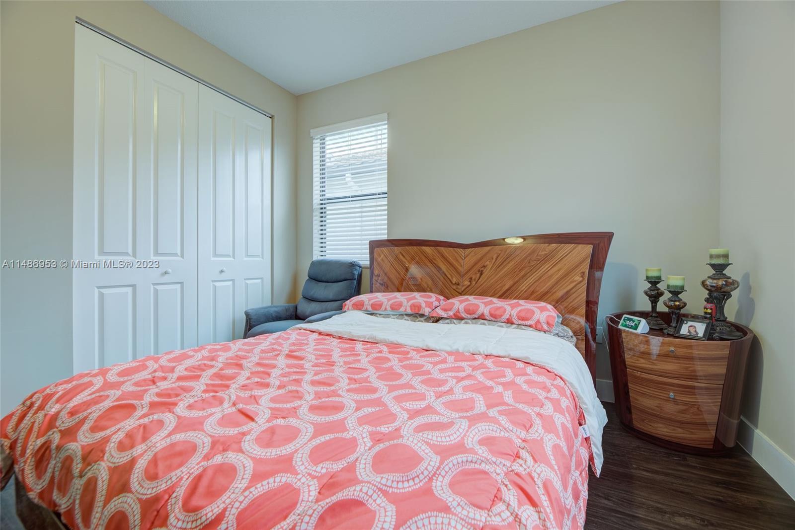 3308 West 95th Terrace Hialeah, FL 33018 - Photo 19 of 43 a bedroom with a bed and a window