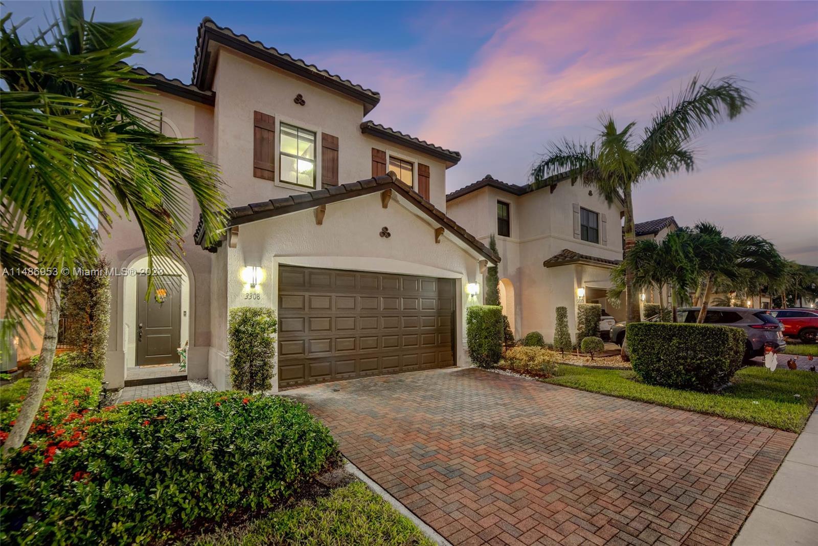 3308 West 95th Terrace Hialeah, FL 33018 - Photo 2 of 43 a front view of a house with a yard