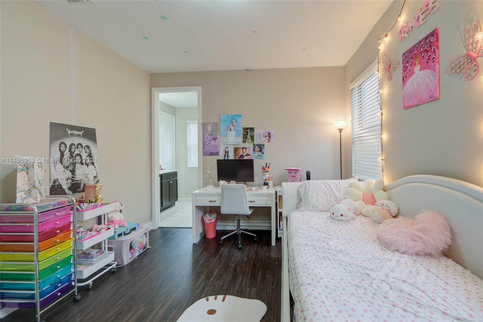 3308 West 95th Terrace Hialeah, FL 33018 - Photo 24 of 43 a bedroom with a bed and wooden floor