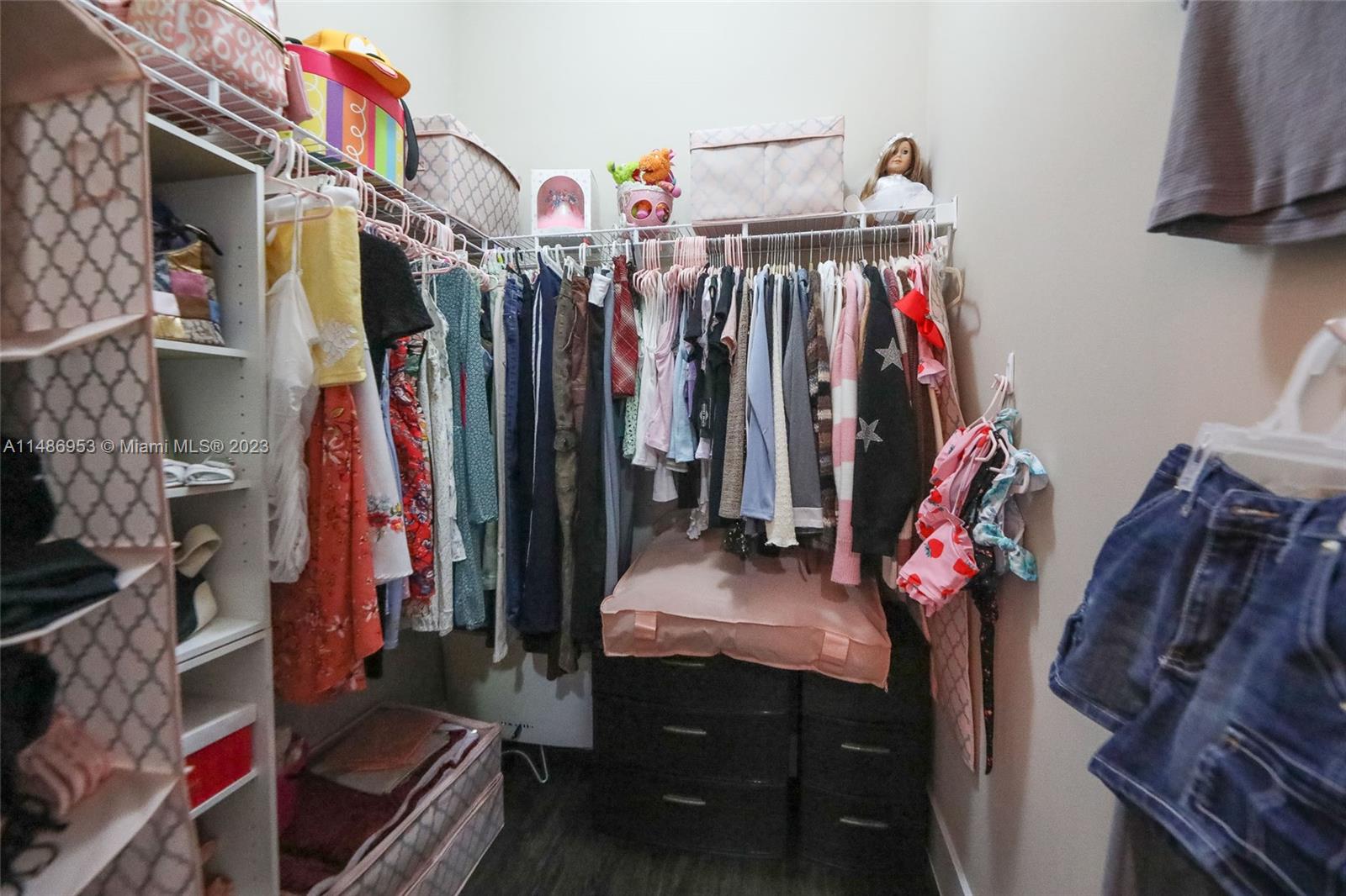 3308 West 95th Terrace Hialeah, FL 33018 - Photo 25 of 43 a view of walk in closet with clothes