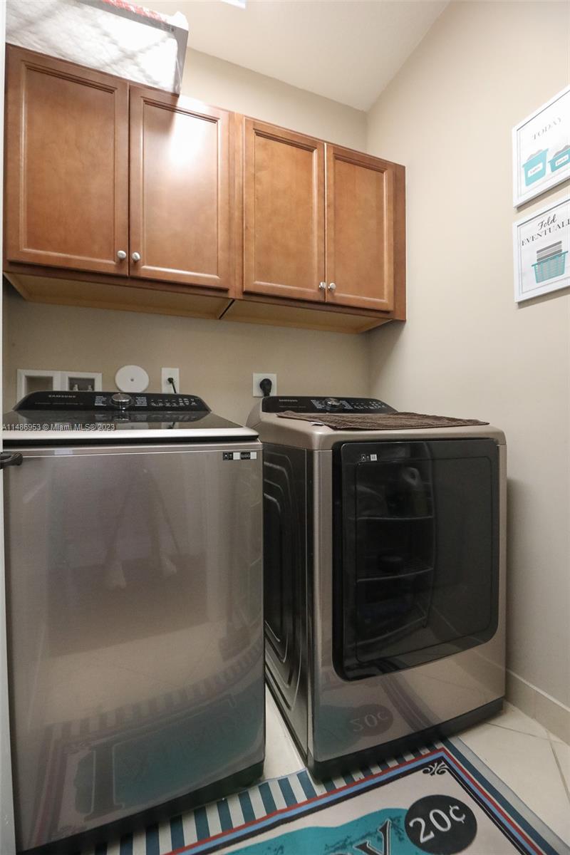 3308 West 95th Terrace Hialeah, FL 33018 - Photo 26 of 43 a close view of a stove top oven and cabinets