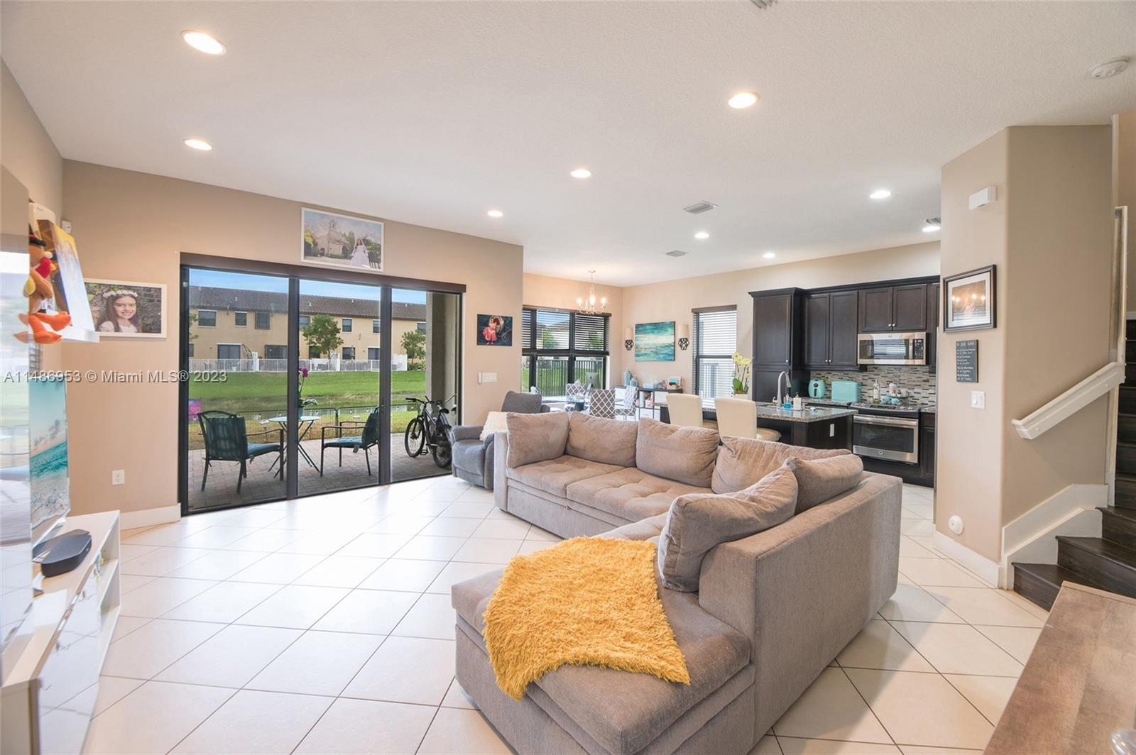 3308 West 95th Terrace Hialeah, FL 33018 - Photo 3 of 43 a living room with furniture and a large window
