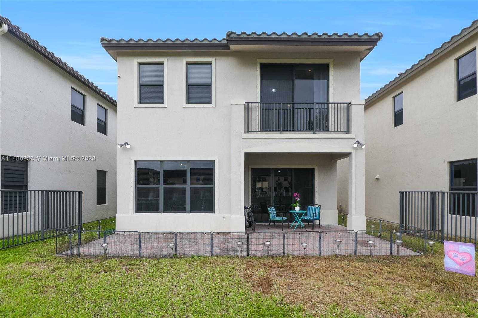 3308 West 95th Terrace Hialeah, FL 33018 - Photo 31 of 43 a view of a house with a yard and porch