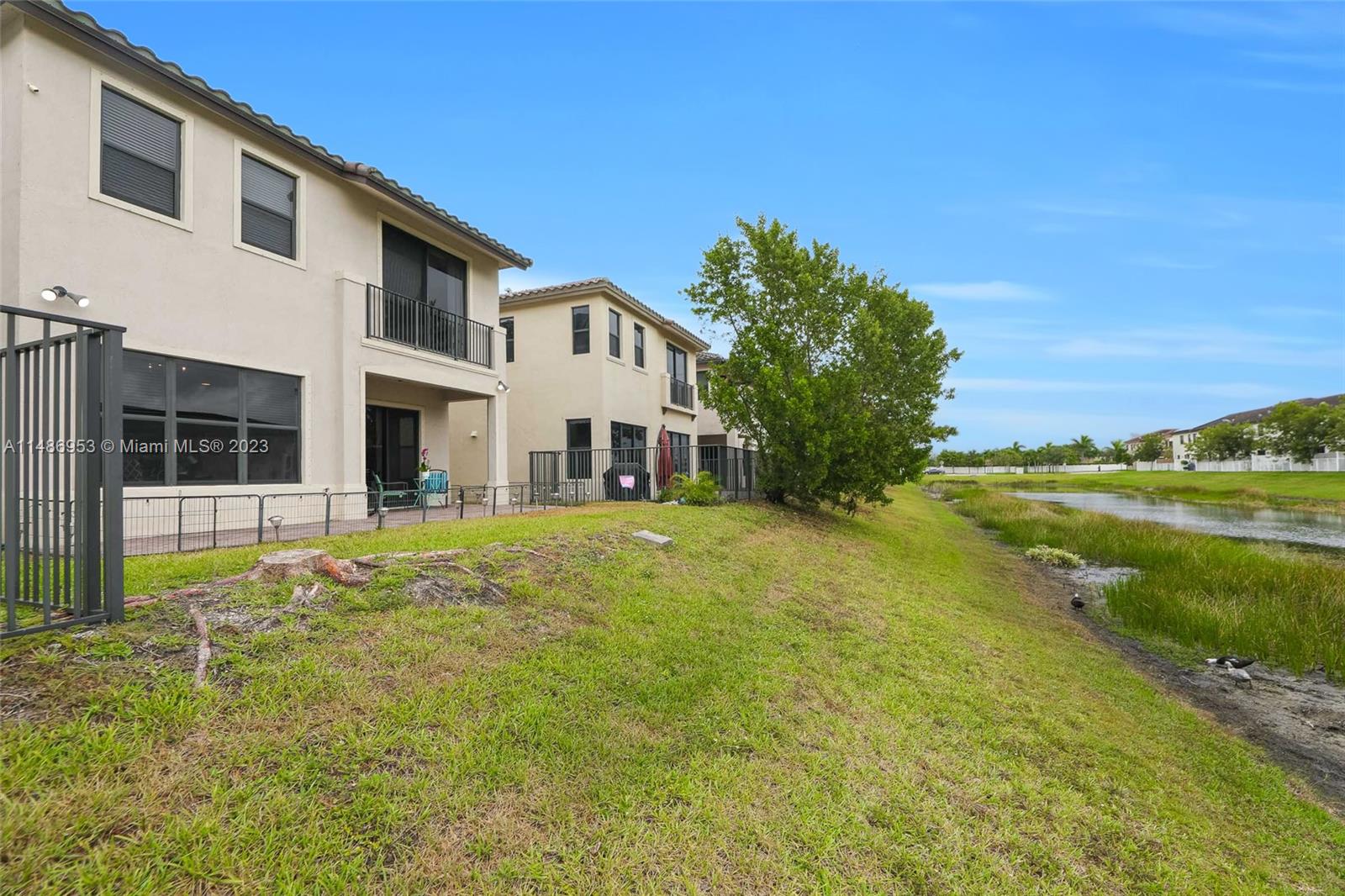 3308 West 95th Terrace Hialeah, FL 33018 - Photo 34 of 43 a front view of a house with a yard
