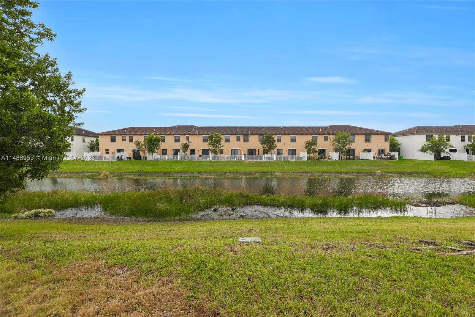 3308 West 95th Terrace Hialeah, FL 33018 - Photo 35 of 43 a view of a lake with a city