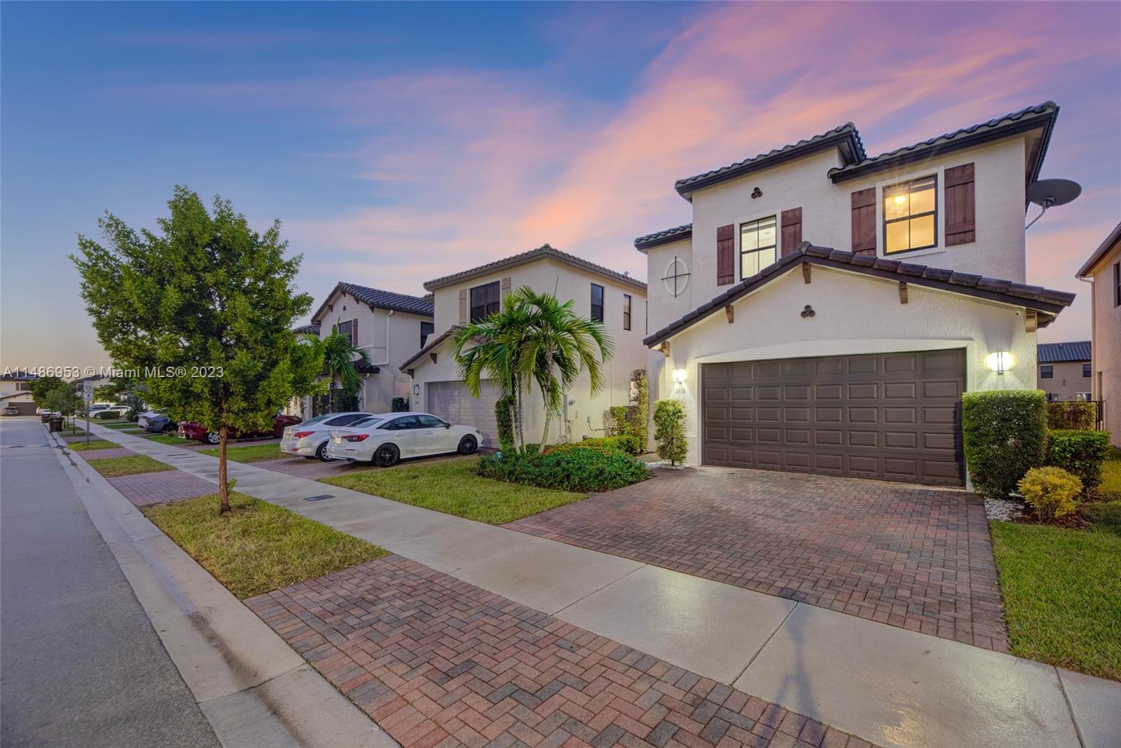 3308 West 95th Terrace Hialeah, FL 33018 - Photo 39 of 43 a front view of a house with garden