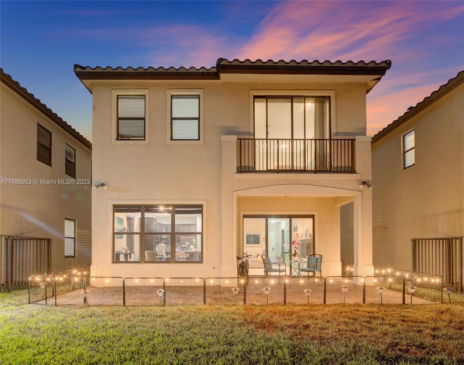 3308 West 95th Terrace Hialeah, FL 33018 - Photo 40 of 43 a front view of a house with a yard