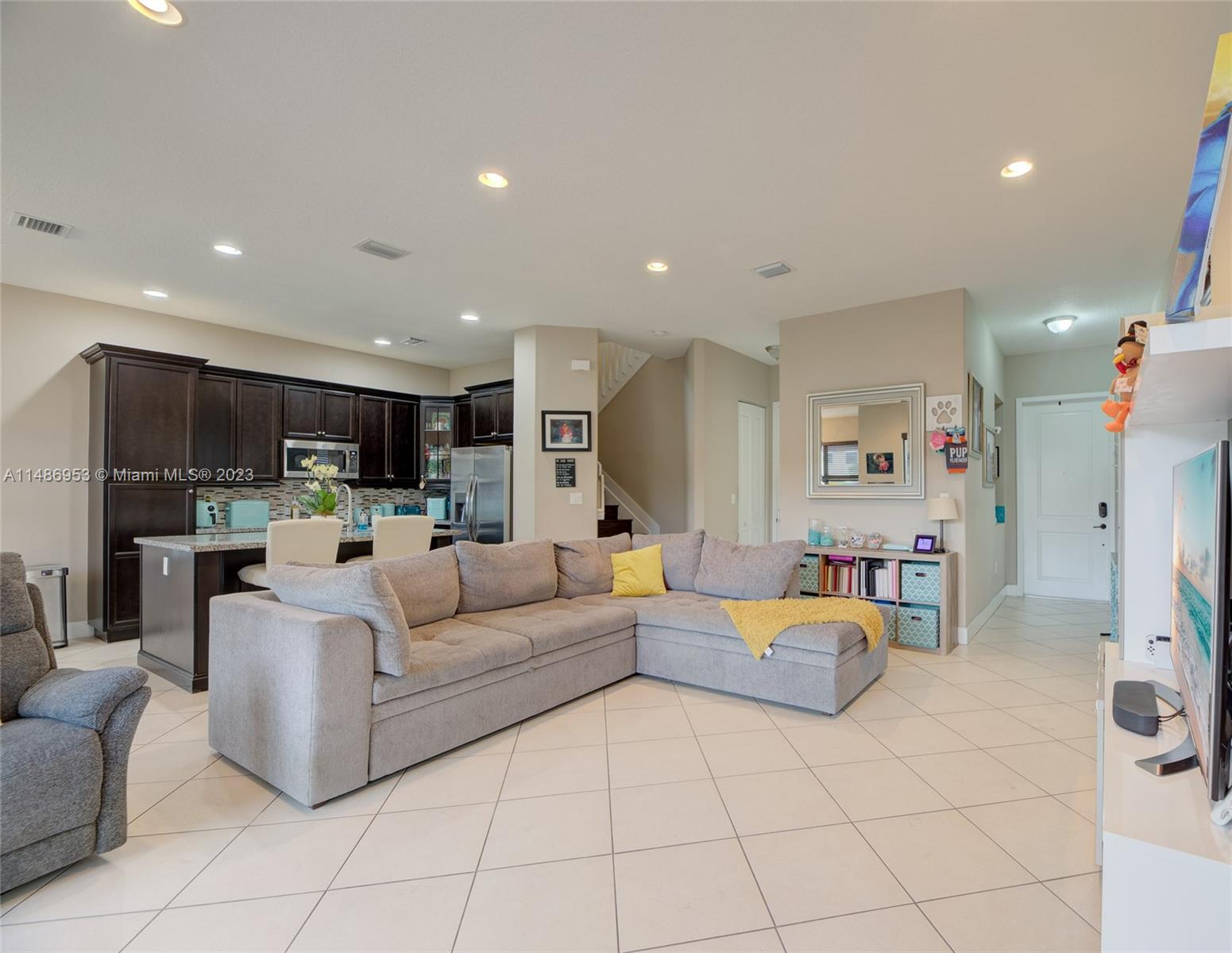 3308 West 95th Terrace Hialeah, FL 33018 - Photo 5 of 43 a living room with furniture and a wooden floor