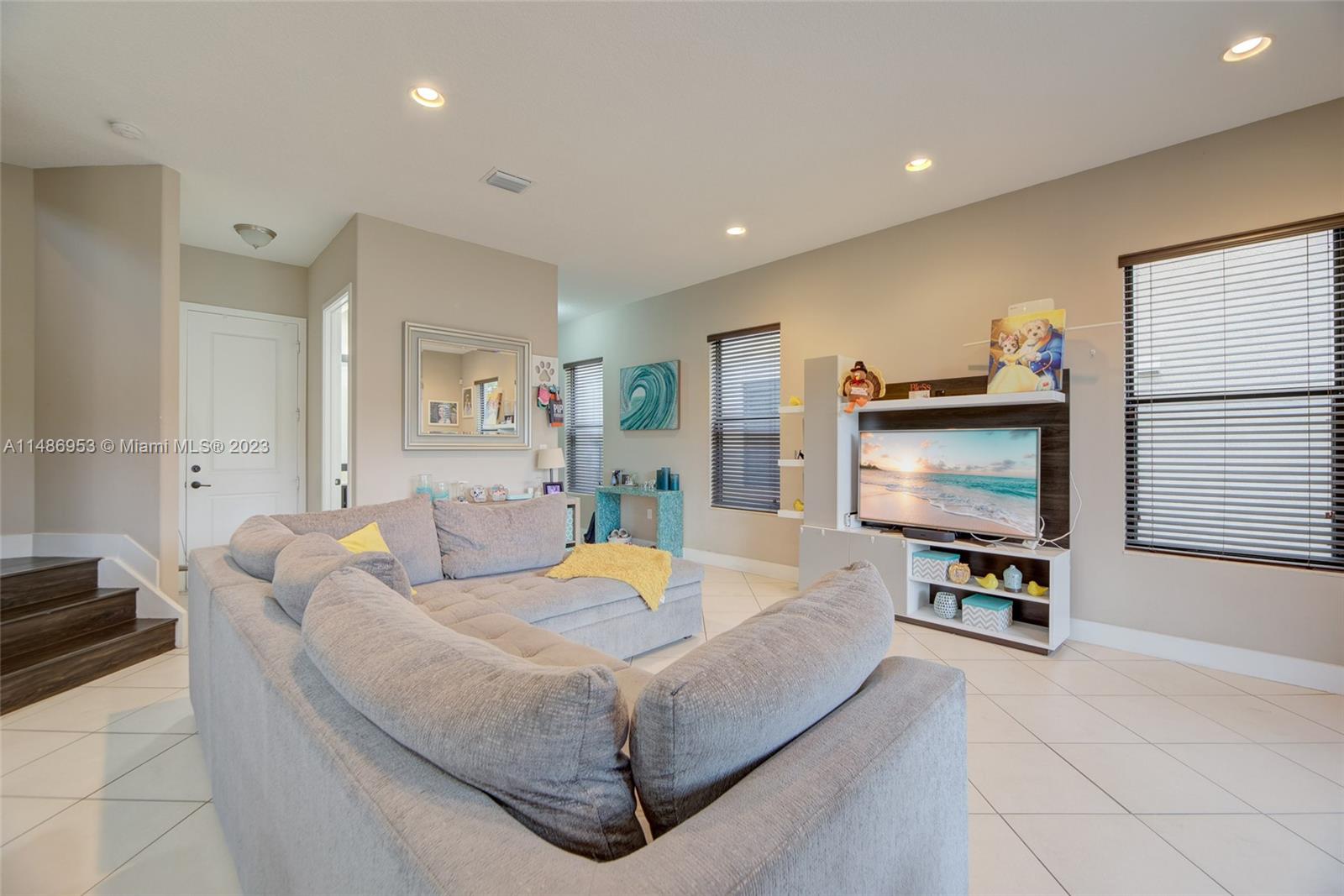 3308 West 95th Terrace Hialeah, FL 33018 - Photo 6 of 43 a living room with furniture and a flat screen tv