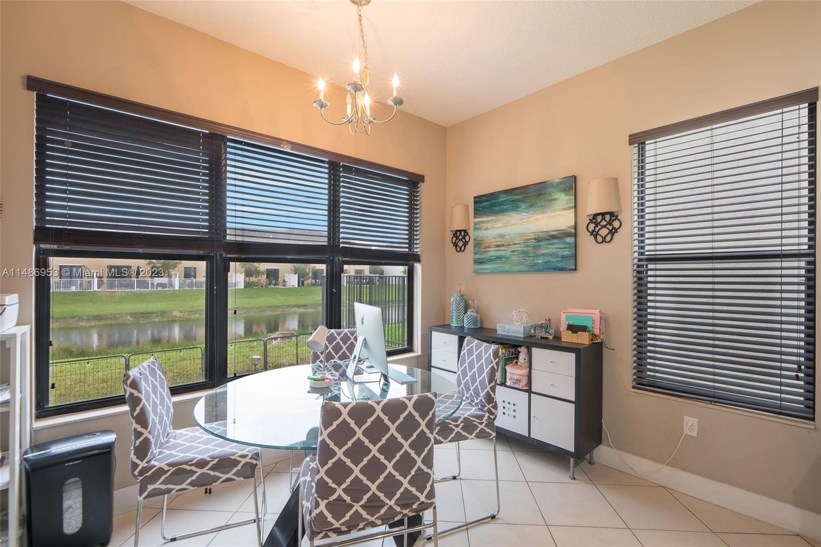 3308 West 95th Terrace Hialeah, FL 33018 - Photo 9 of 43 a dining room with furniture and chandelier kitchen view