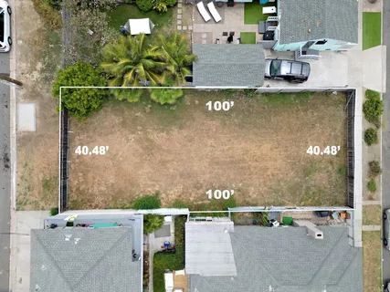 an aerial view of a house with a lake view
