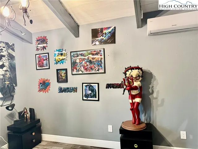 a bed sitting in a bedroom and dressers