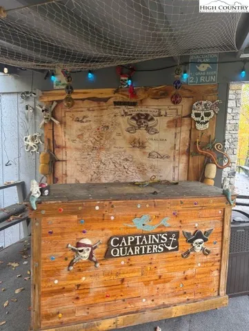 a view of a yard with plants and trees