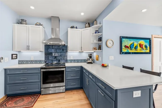 a kitchen with a stove and a sink