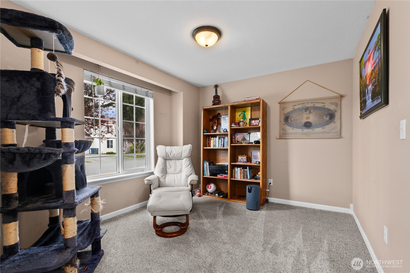 427 Klinger Street Sedro-Woolley, WA 98284 - Photo 4 of 25 a living room with furniture a rug and a bookshelf