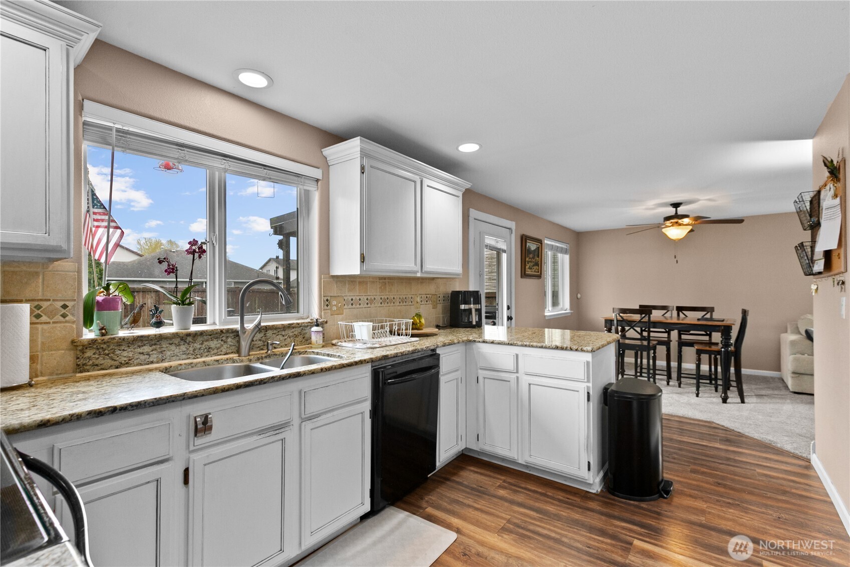 427 Klinger Street Sedro-Woolley, WA 98284 - Photo 10 of 25 a kitchen with a sink stove and cabinets