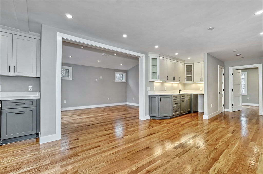 111 Cedar Street Lexington, MA 02421 - Photo 11 of 40 a open kitchen with a sink and cabinets