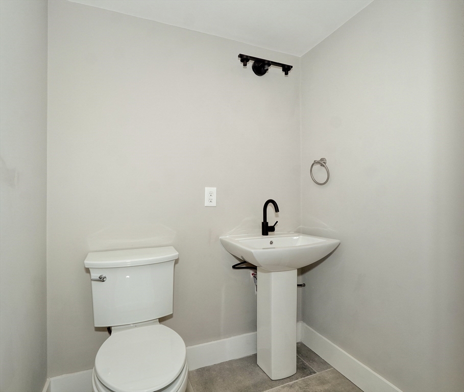 111 Cedar Street Lexington, MA 02421 - Photo 13 of 40 a bathroom with a sink a mirror and toilet
