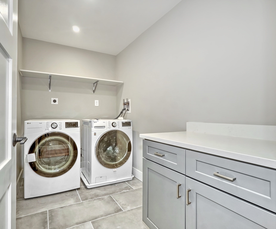 111 Cedar Street Lexington, MA 02421 - Photo 20 of 40 a utility room with dryer and washer