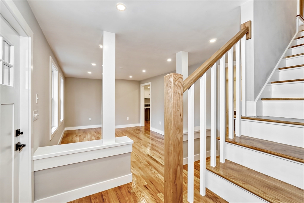 111 Cedar Street Lexington, MA 02421 - Photo 2 of 40 a view of an entryway with wooden floor and door