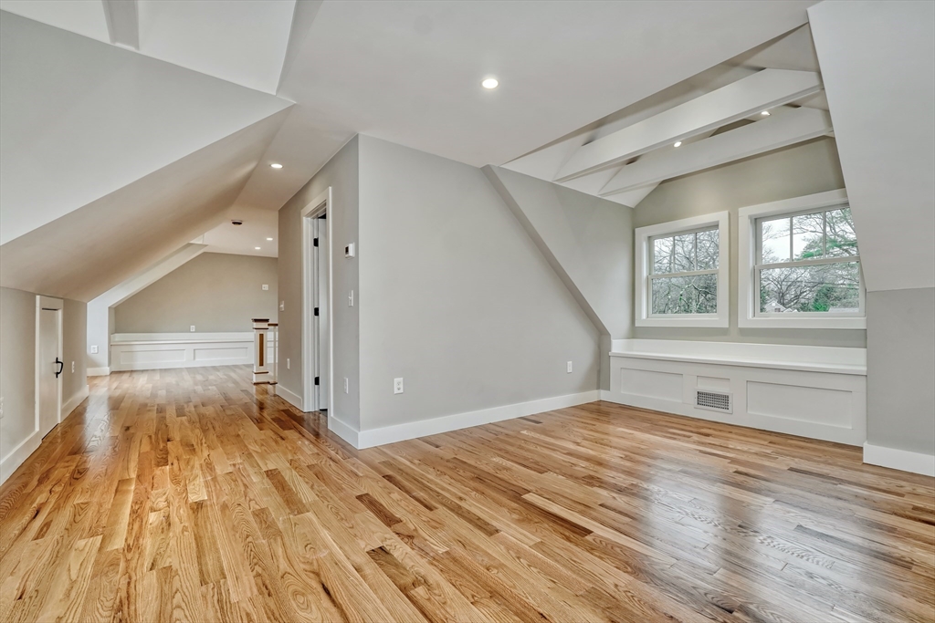 111 Cedar Street Lexington, MA 02421 - Photo 28 of 40 a view of empty room with wooden floor and fan