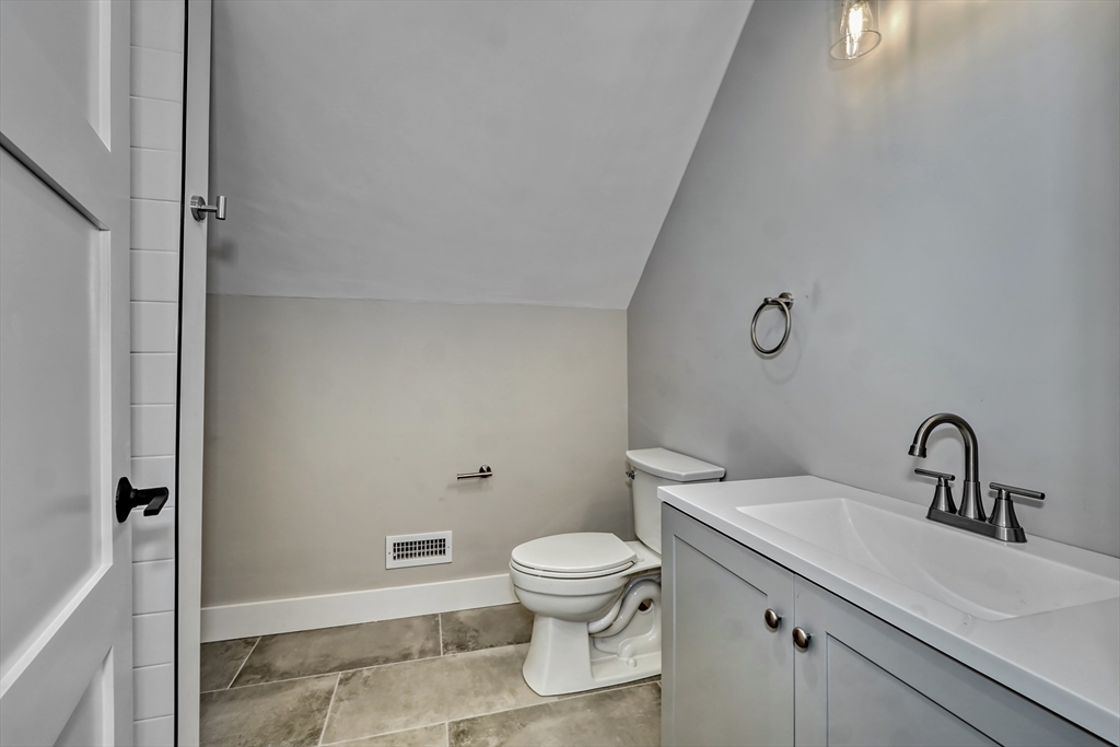 111 Cedar Street Lexington, MA 02421 - Photo 29 of 40 a bathroom with a sink a toilet and shower