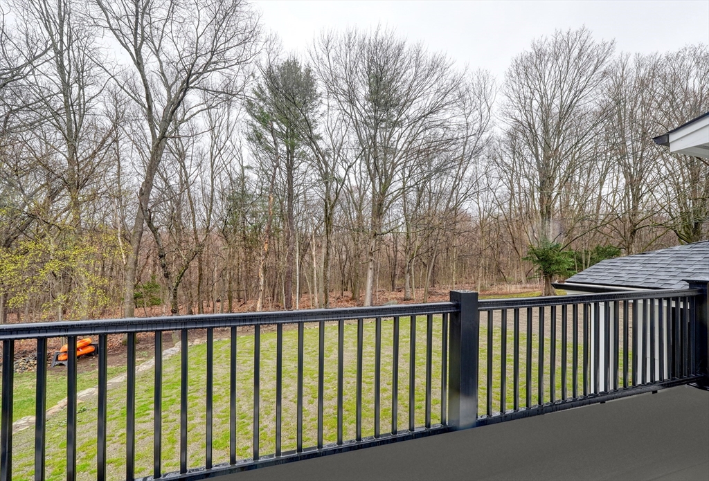 111 Cedar Street Lexington, MA 02421 - Photo 36 of 40 a balcony with trees in front of it