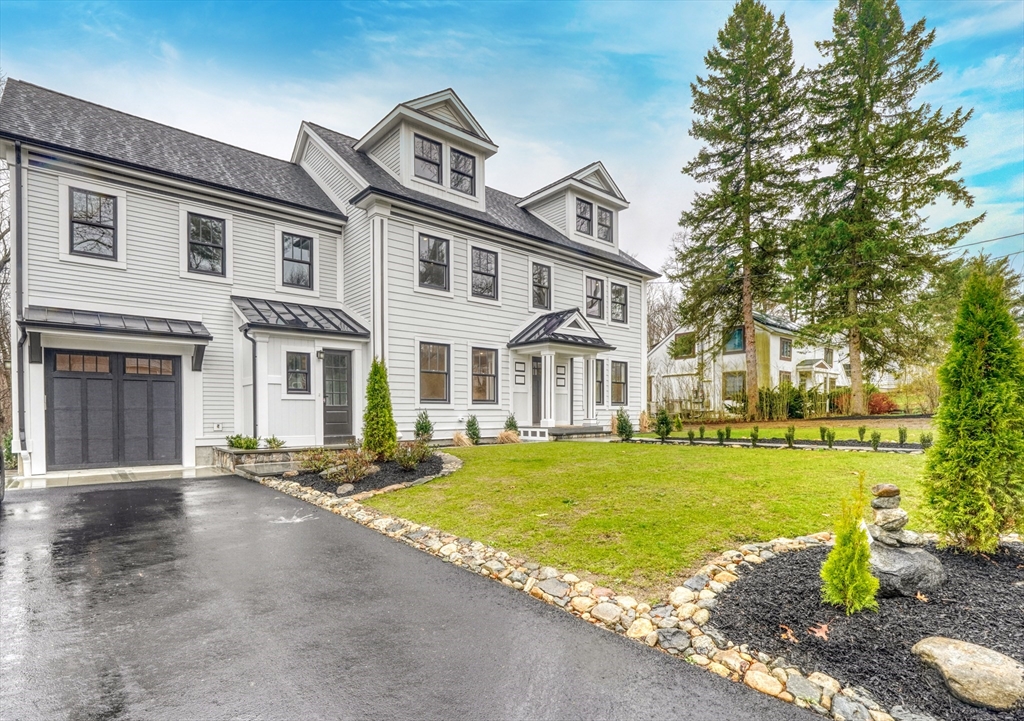111 Cedar Street Lexington, MA 02421 - Photo 40 of 40 a front view of a house with a garden and trees