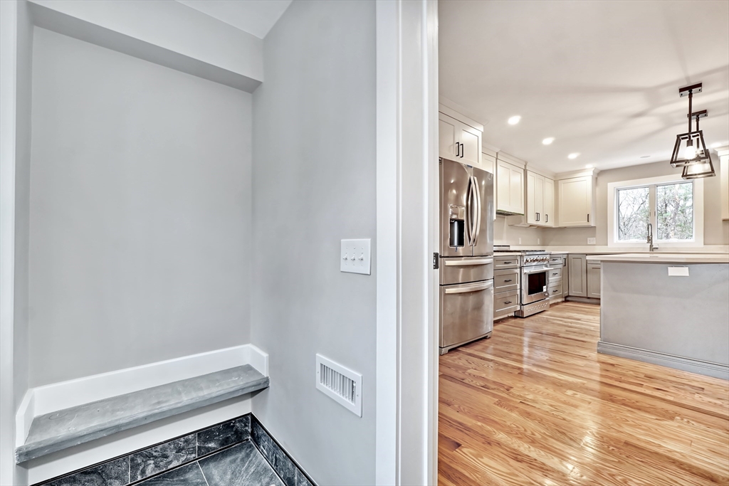 111 Cedar Street Lexington, MA 02421 - Photo 5 of 40 a kitchen with cabinets and wooden floor