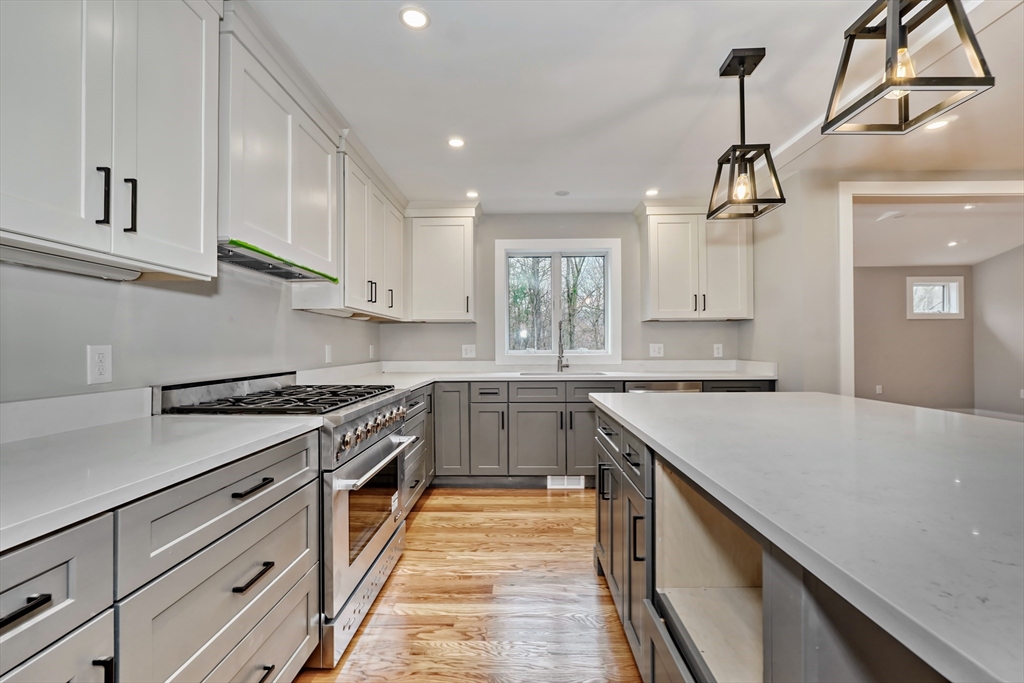 111 Cedar Street Lexington, MA 02421 - Photo 7 of 40 a kitchen with a stove sink and cabinets