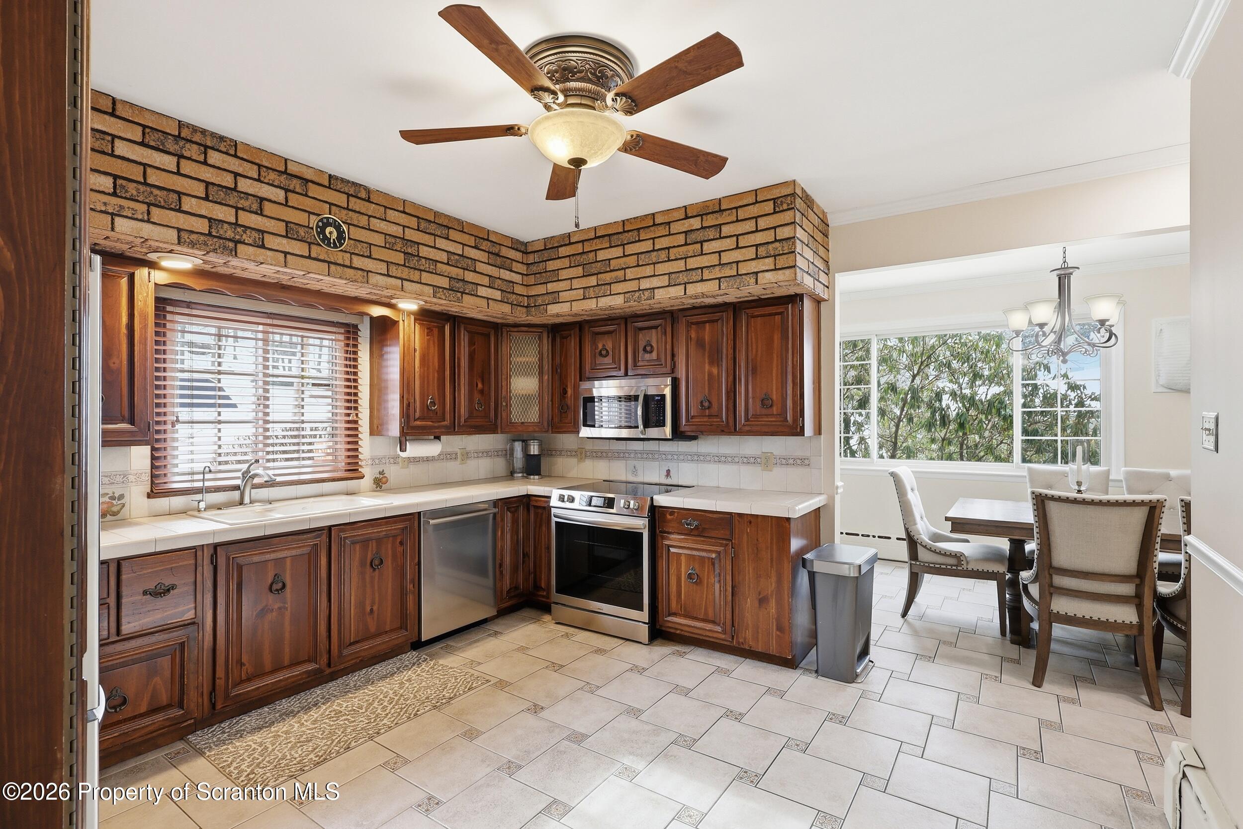 143 Old Boston Road Pittston, PA 18640 - Photo 15 of 61 a open kitchen with stainless steel appliances granite countertop a stove and a sink