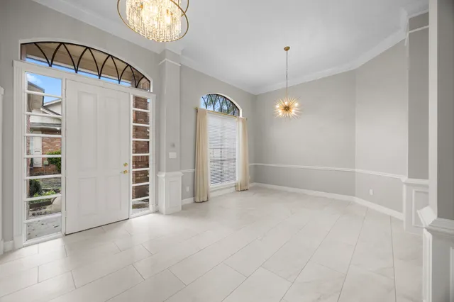 an empty room with closet and windows