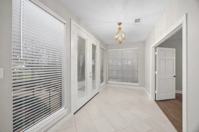 a view of a hallway with windows