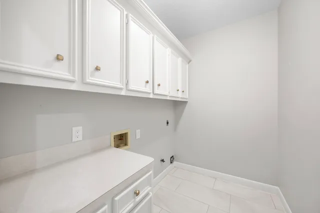 a bathroom with a sink and cabinets
