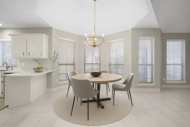 a view of a dining room with furniture window and outside view