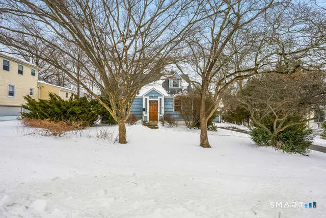 a view of a house with snow yard
