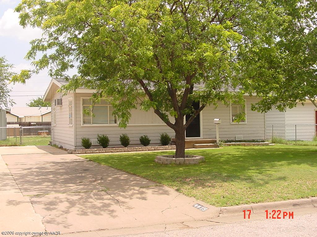 4415 Cline Road Amarillo, TX 79110 - Photo 1 of 2 a view of a house with a yard and palm trees