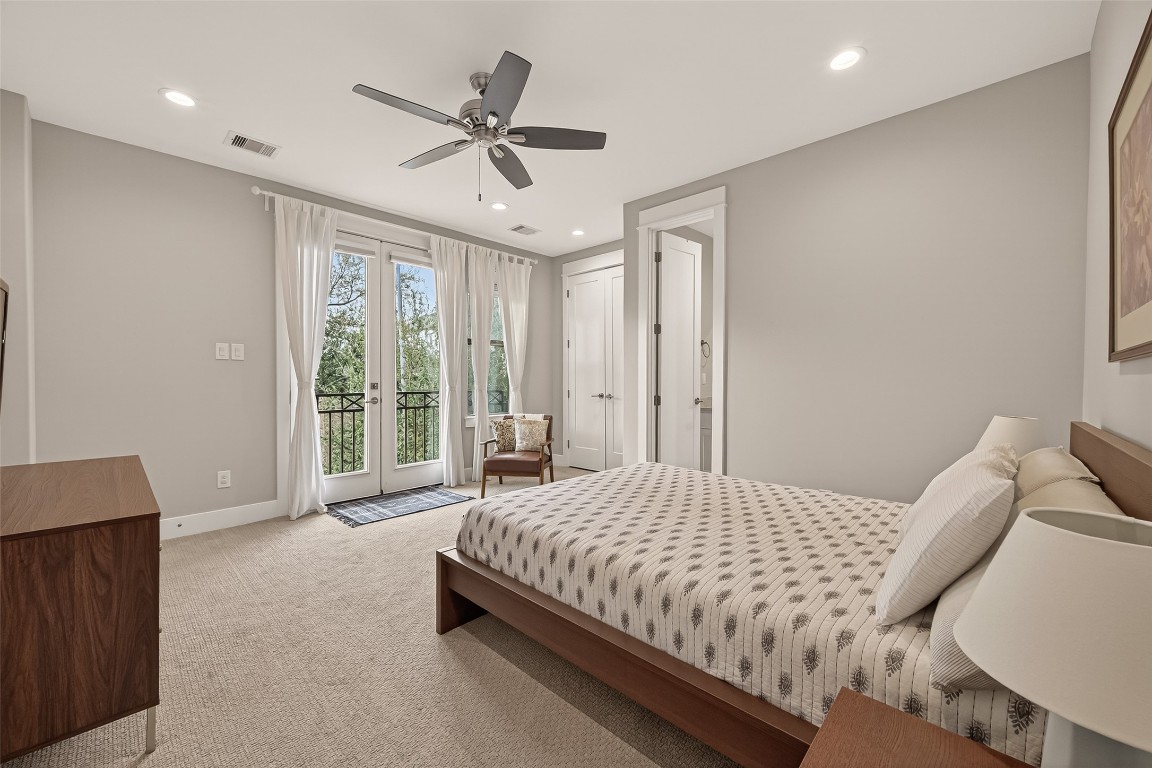 604 West Pierce Street Houston, TX 77019 - Photo 16 of 33 a bedroom with a bed and glass window