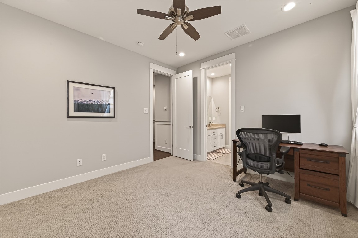 604 West Pierce Street Houston, TX 77019 - Photo 18 of 33 a view of a workspace with furniture and a ceiling fan