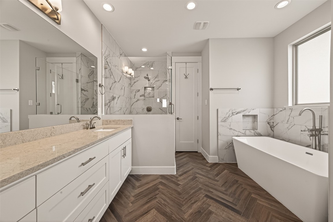 604 West Pierce Street Houston, TX 77019 - Photo 26 of 33 a spacious bathroom with a double vanity sink a mirror and a shower