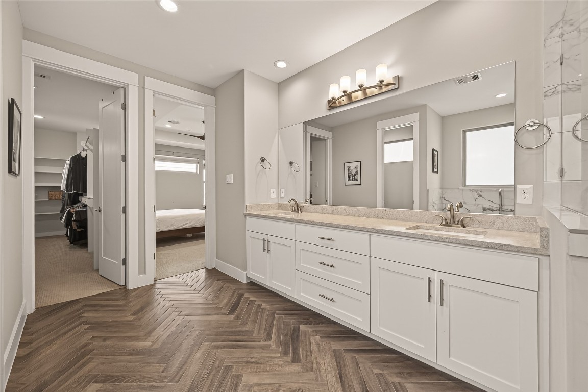 604 West Pierce Street Houston, TX 77019 - Photo 27 of 33 a spacious en suite bathroom with a granite countertop sink mirror and shower